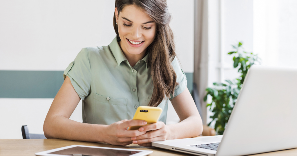 15 Tips for Creating a Great Digital Customer Experience - smiling woman using phone, tablet, and computer