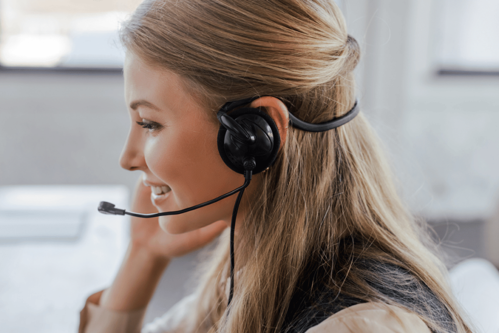 What is Pattern Matching in AI Quality Assurance? A smiling woman wears an operator headset.