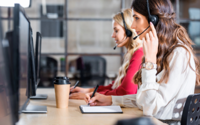 Is My Call Center Ready for Quality Assurance? two female call center employees work at their computers wearing headsets.